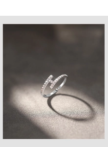 Macro shot of S925 silver stamp inside the pavé cubic zirconia H-shaped ring band