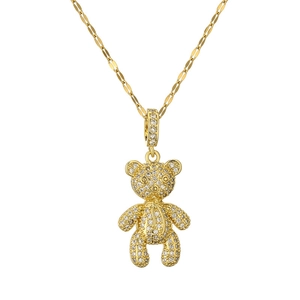 Golden teddy bear pendant necklace with micro-paved cubic zirconia on white background
