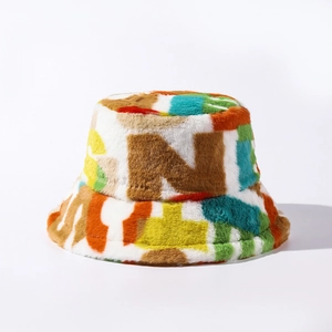 Close-up of colorful faux fur bucket hat featuring a brown letter N patch design