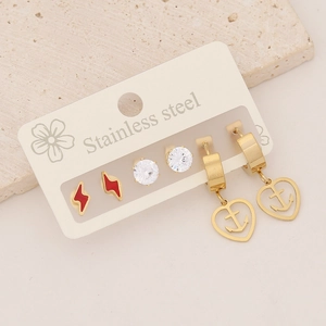 Macro view of gold stainless steel stud earrings set featuring heart and lightning designs