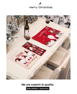 Close-up of festive Christmas placemats with gnome embroidery and red plaid edges
