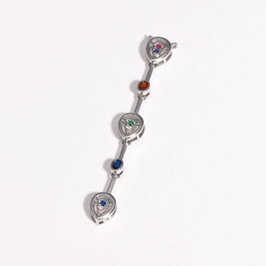 Macro detail of silver long pendant with multi-colored zircons and teardrop frames