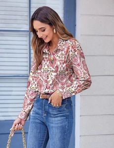 Close-up of elegant floral print long sleeve shirt with vintage patterns and lapel collar