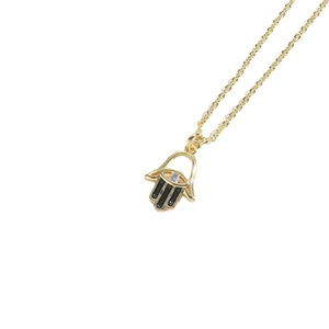 Golden Hamsa hand necklace with black enamel teardrop pendant and sparkling white crystal
