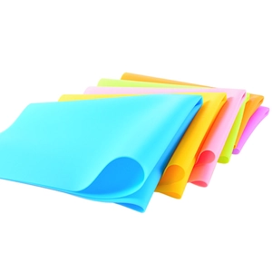 Set of six colorful rectangular silicone placemats in a neat fan-shaped arrangement