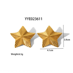 Detail of large gold star earrings showing radial textures and 3.9cm by 4.1cm dimensions