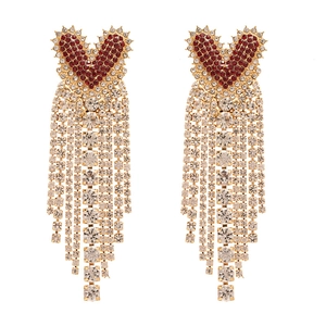 Luxurious gold heart tassel earrings with red and white crystal rhinestones on white background