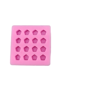 Pink food-grade silicone mold featuring 16 mini flower cavities for chocolate making