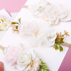 Detail of floral baby headbands with soft tulle flowers and elastic nylon bands