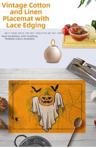 Macro shot of Halloween linen placemat featuring pumpkin ghost and bat patterns