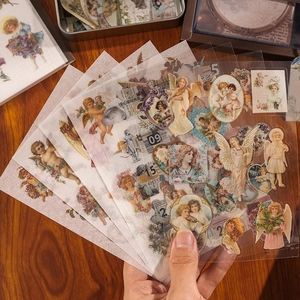 Vintage scrapbook sticker kit featuring classical angel and floral PET designs on wood