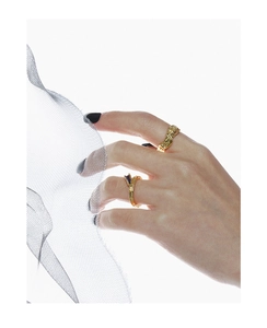 Detail of S925 silver irregular textured ring and purple gemstone ring on hand