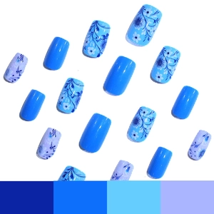 Blue floral press-on nails with mixed solid colors and artistic leaf patterns on square shapes