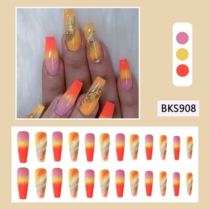 Pink and orange gradient long coffin press-on nails with marble design and gold foil detail