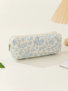 Detailed view of light blue floral quilted cotton pencil case with zipper closure