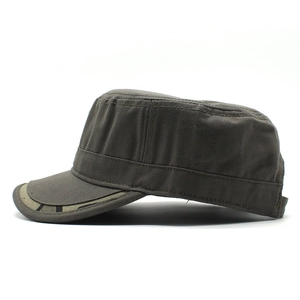 Detail of dark gray cotton cadet cap showing reinforced stitching and geometric brim texture