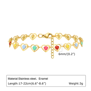 Detail view of gold stainless steel heart link bracelet with colorful enamel inlay