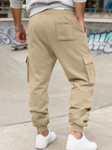 Detailed back view of khaki cargo joggers with side flap pockets and ribbed cuffs