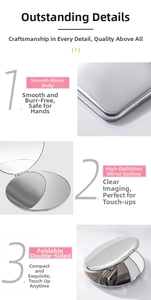 Macro view of portable stainless steel folding makeup mirror with rounded silver frame