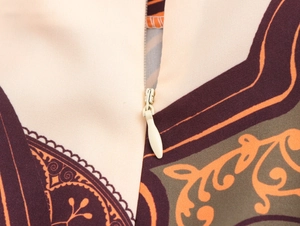 Close-up of invisible zipper detail on vintage print resort beach shirt set