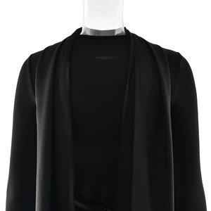 Close-up of elegant black cowl neck collar and draped fabric detail on a mannequin