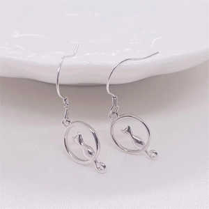 Macro view of S925 sterling silver hoop earrings with sitting cat silhouette design