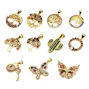 Collection of gold copper pendants with zircon butterfly tree and key designs