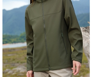 Detail of olive green softshell jacket with grid texture and hidden zipper pocket