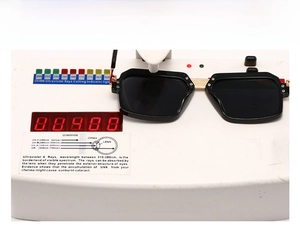 Macro testing of black retro oversized sunglasses showing UV400 protection on a device