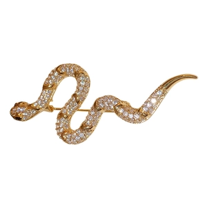 Gold plated snake brooch featuring white cubic zirconia crystals for suit accessories