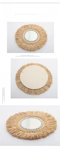 Detail view of woven raffia mirror with gray beads and sturdy wooden back with hook