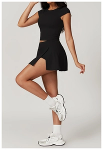 Side view of black racerback crop top and matching slit sports skirt with high elasticity