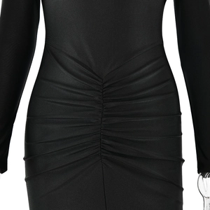Detailed view of black dress featuring elegant ruched waist design and stretch fabric texture