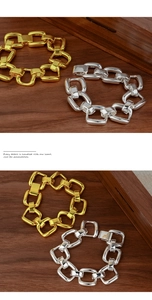 Close-up detail of heavy chain bracelet showing 925 silver stamp and link textures