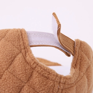 Adjustable brown plush baby baseball cap with diamond quilted pattern and velcro closure