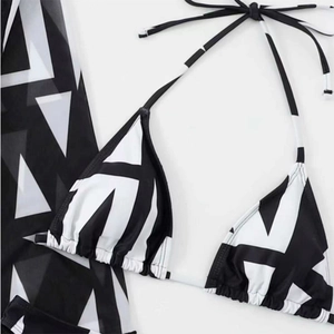 Detailed view of the black and white geometric pattern on the high-elastic bikini fabric