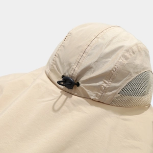 Detail of outdoor sun hat with breathable beige mesh fabric and adjustable drawstring toggle
