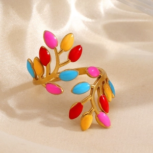 Gold leaf ring with colorful enamel inlay on silk background, adjustable opening design