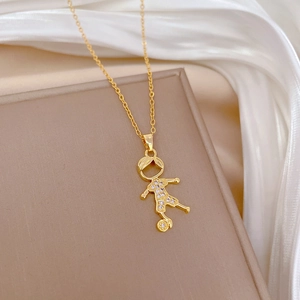 Luxurious gold soccer boy necklace with sparkling crystals on elegant white satin