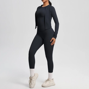 Close-up of high-elastic black yoga set including zipper jacket and slim leggings