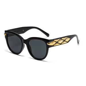 Retro oval sunglasses with wide temples and gold diamond-shaped metal accents