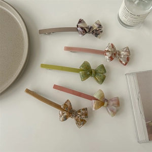 Minimalist acetate bow hair clips in assorted colors for women with elegant French style