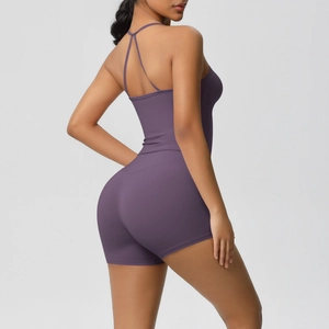 Detail of dark purple yoga bodysuit showing slim fit criss-cross open back design
