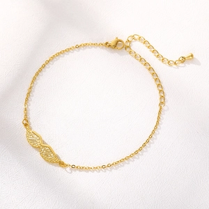 Golden angel wing charm bracelet in polished stainless steel with adjustable chain