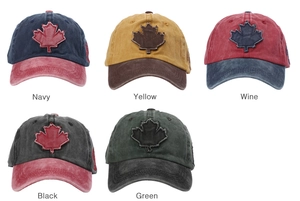 Detail of five washed cotton baseball caps with maple leaf patches in various color combos