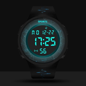 Detail view of the luminous blue digital display on black sports watch face