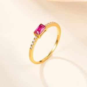 Macro view showing S925 hallmark on gold plated silver ring with red zircon