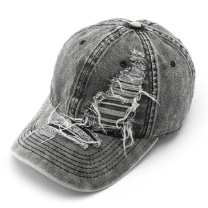 Distressed vintage washed grey baseball cap with ripped hole design on curved brim