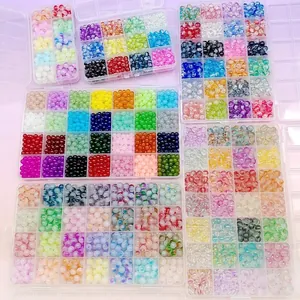 Colorful DIY glass seed bead kit in transparent plastic organizer boxes for jewelry making