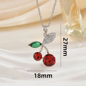 Macro shot of cherry pendant showing 27mm height and 18mm width dimensions